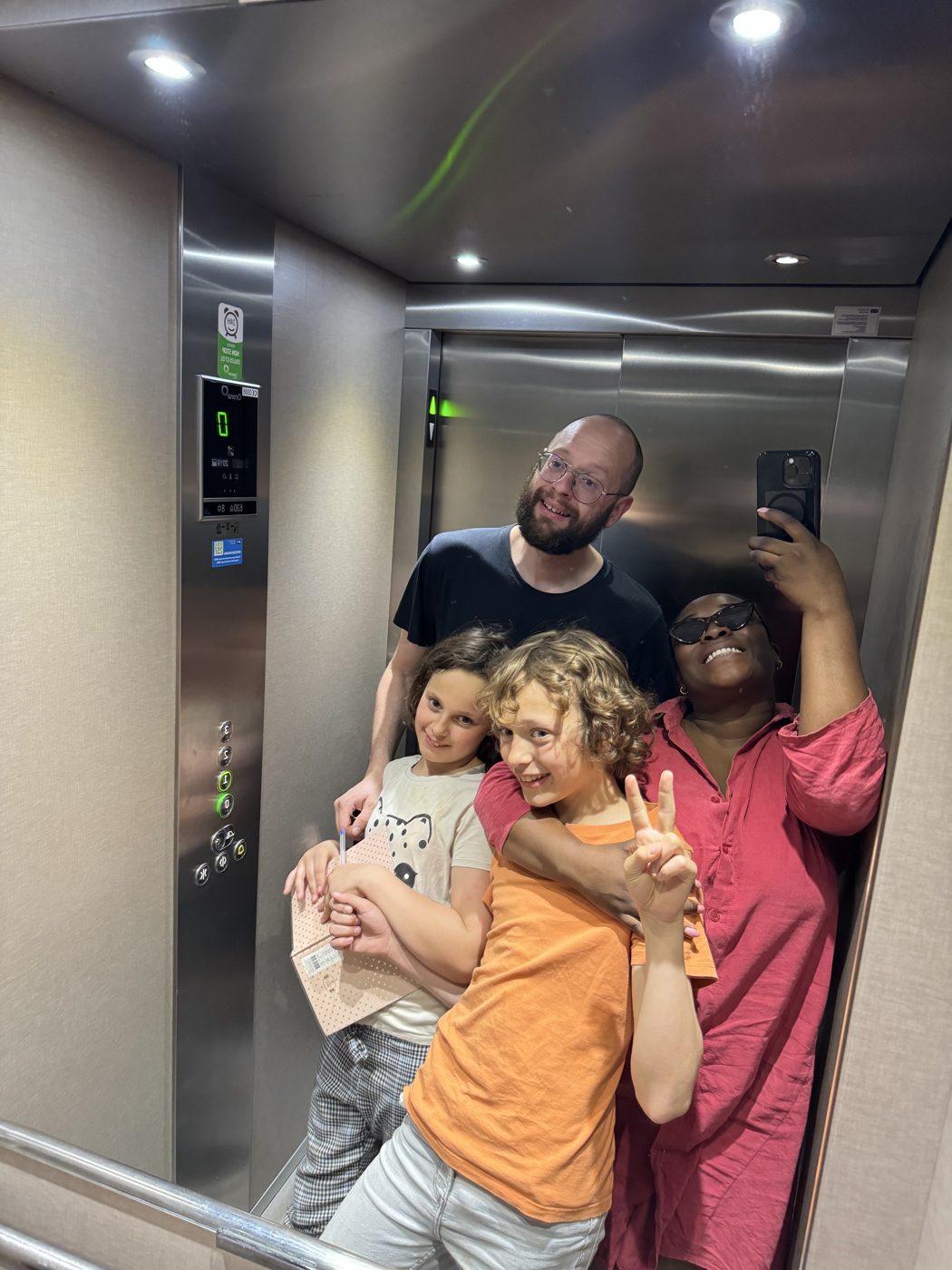 Family selfie in a lift